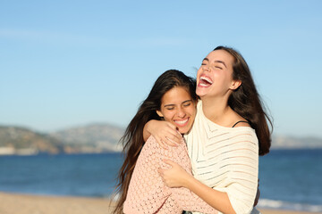 Happy friends hugging laughing very funny