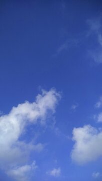 blue sky with clouds. Beautiful blue sky. Daylight on summer season. White clouds with blue sky as background. Nature wallpaper hd. Looking straight up at the sky. 