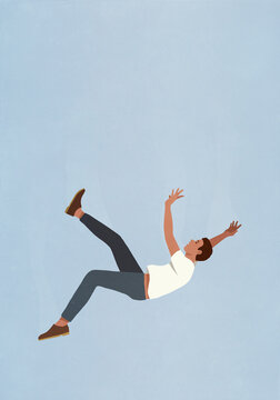 Man falling midair against blue sky
