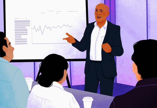 Businessman leading conference room meeting at screen, reviewing data
