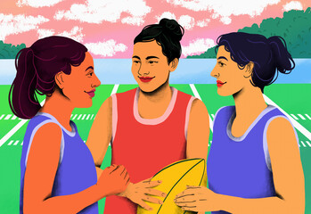 Young female rugby players talking on rugby field

