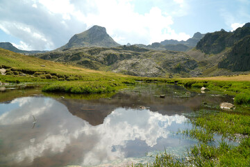 mountain landscape with a lake in the pyrenees. Disconnection from technology