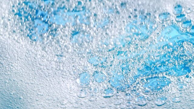 Super Slow Motion Shot of Bubbling Light Blue Background at 1000fps.