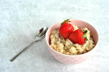 healthy breakfast with porridge and strawberry copy space 