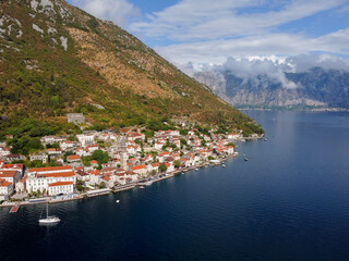 Aerial drone high view of Kotor bay, Boka Kotorska and coastal town Kotor, Cattaro, in Montenegro. Location place famous resort Montenegro. Adriatic fjord surrounded by rugged mountains