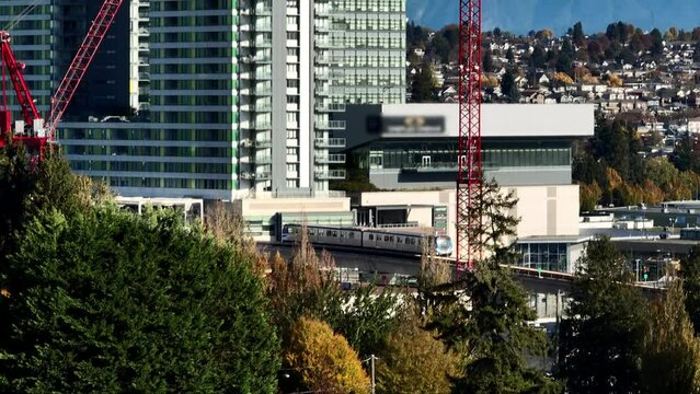 SkyTrain Arrived At Marine Drive Station, Elevated Metro Station in Vancouver, Canada. - aerial shot