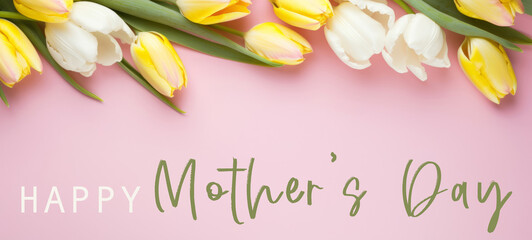 Happy Mother's Day celebration holiday greeting card with text - Pink and yellow tulips on pink table texture background