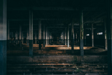 Interior of abandoned factory during with lots of columns