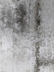 Abstract ice textures on a car window in winter