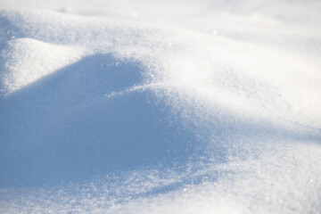 Fototapeta na wymiar background of white snow under the sun