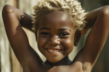 A young girl with blonde hair smiling at the camera. Perfect for capturing joy and happiness in everyday moments