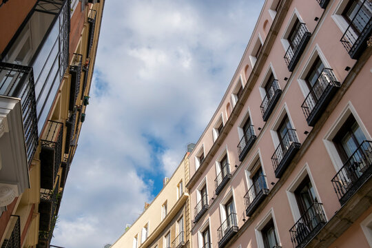 Colorful facades of apartment buildings in the Opera neighborhood in the center of Madrid in Spain