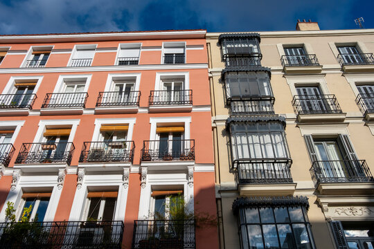Colorful facades of apartment buildings in the Opera neighborhood in the center of Madrid in Spain