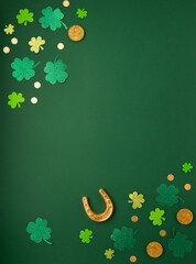 Golden Horseshoe, Gold Coins and Clover Leaves Shamrocks on Green Background for St Patricks Day...