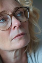 Fototapeta premium Close up shot of a woman wearing glasses. Suitable for business, education, or lifestyle concepts