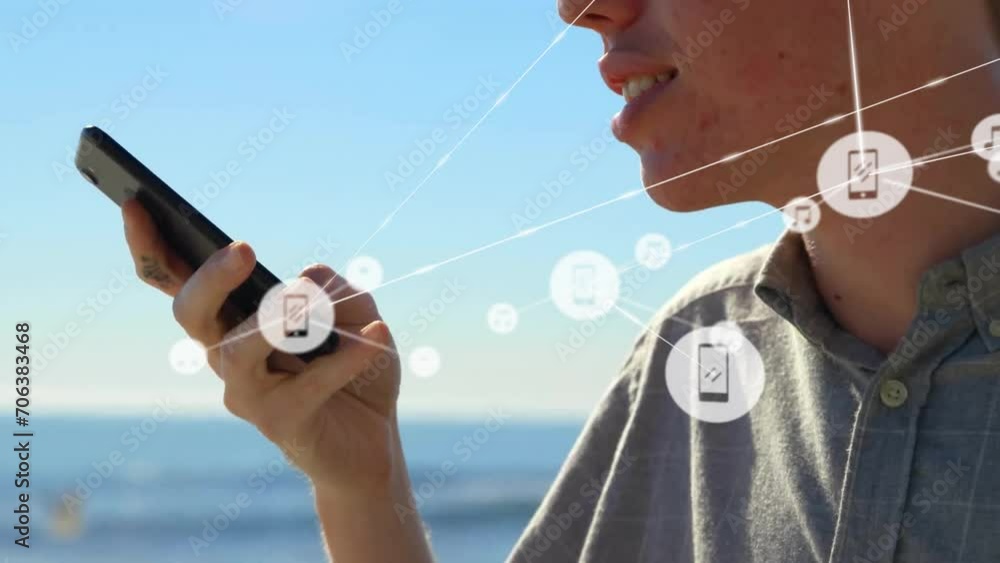 Poster animation of network of connected icons in circles over happy caucasian man using smartphone