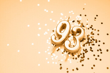 93 years celebration festive background made with golden candles in the form of number Ninety-third...
