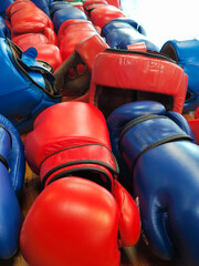 Boxing helmets and gloves in blue and red