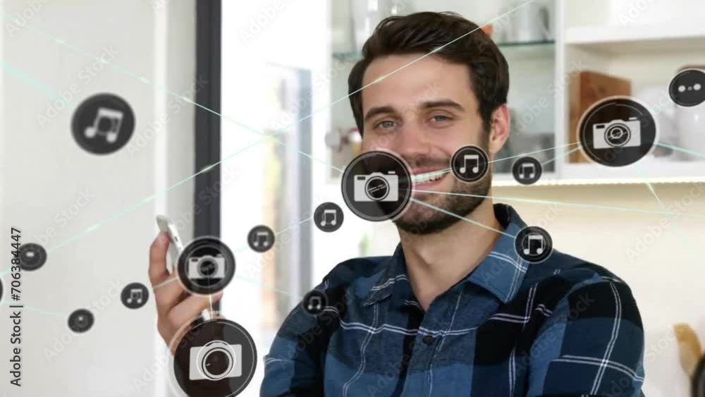Poster animation of network of connected icons in circles over happy caucasian man using smartphone