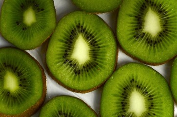 Fototapeta premium sliced ​​kiwi lies on a white background