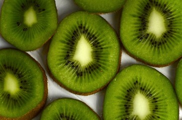 sliced ​​kiwi lies on a white background