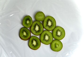 sliced ​​kiwi lies on a white background