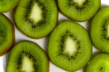 Fototapeta premium sliced ​​kiwi lies on a white background