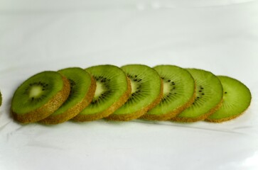 sliced ​​kiwi lies on a white background