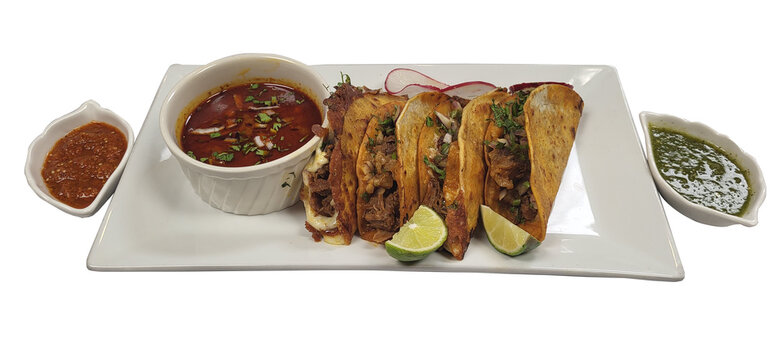 Traditional mexican quesabirria tacos with consomm&eacute; and lime