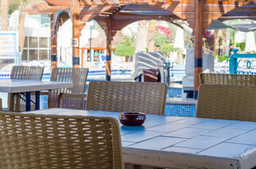 Fototapeta na wymiar empty cafe near the pool without people