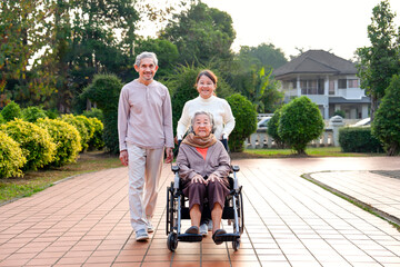 concept of family lifestyle, relationship,senior grandma sitting on wheelchair,smiling,daughter and...