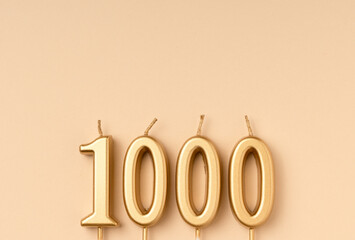 Number 1000 celebration festive background made with golden candles in the form of number Thousand. Universal holiday banner with copy space. - obrazy, fototapety, plakaty