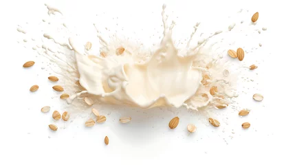 Rolgordijnen Oat milk splash with almonds isolated on white background © growth.ai