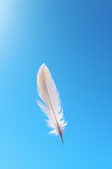 Solitary feather floating in an empty blue sky  AI generated illustration