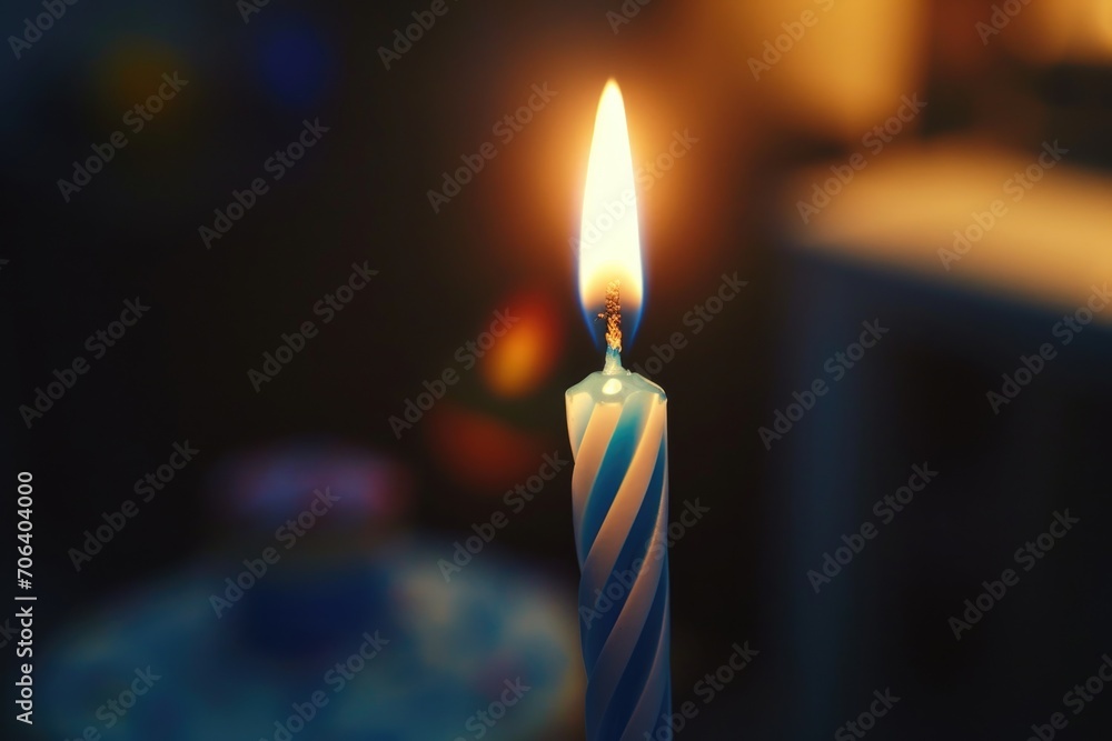Poster a single lit candle sitting on top of a table. suitable for various uses