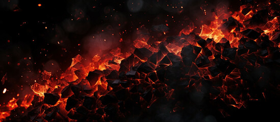 Fototapeta na wymiar Burning coals in the dark smoldering coal bright red sparks of fire background