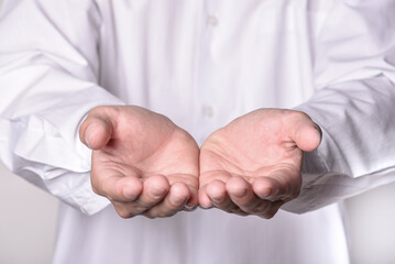 Muslim Person making dua rising hands, Reciting Quran, holding the quran, Making Dhikr Thasbeeh. on...