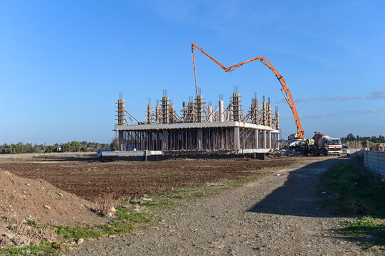machine for pouring concrete at the construction site of a new complex near the sea 3