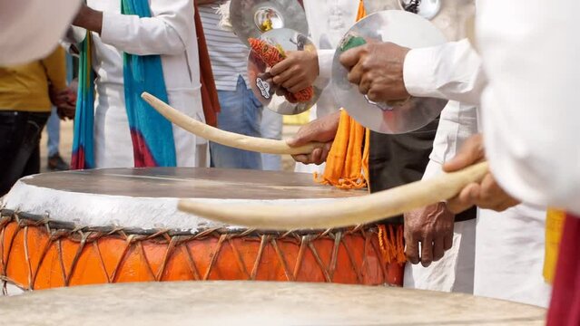 Indian men play traditional drums and musical instruments during SurajKund mela. Nagada and cymbals played to entertain the crowd at a village fair in India - traditional fair  Indian fair  mela