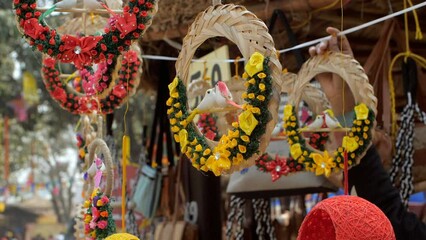 Handcrafted decoration in a shop in India - hanging souvenir items  home decor accessories. Shop with home decorative accessories for the upcoming Hindu Diwali festival at a traditional fair