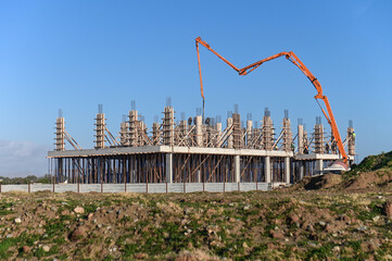machine for pouring concrete at the construction site of a new complex near the sea 5