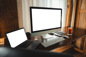 Fototapeta premium Laptop computer blank screen on table in cafe background at home