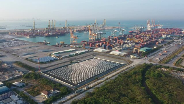 Top view of row new cars produced Several times year at industrial estate in the logistic port export terminal in export and import business and logistics. Shipping cargo to harbor around the world