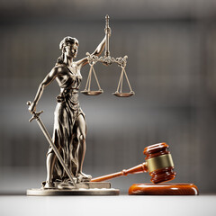 Legal Concept: Themis is the goddess of justice and the judge's gavel hammer as a symbol of law and order on the background of books - obrazy, fototapety, plakaty