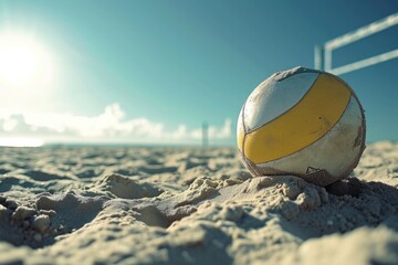 A volleyball ball resting on top of a sandy beach. Perfect for sports and beach-related designs