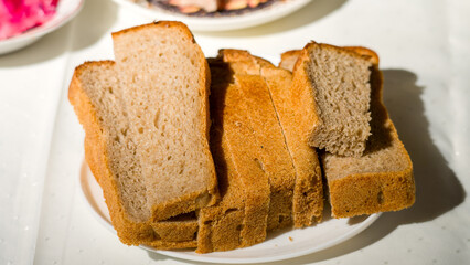 black rye bread cut into pieces, pieces of black bread. Selective Focus, Toned Image