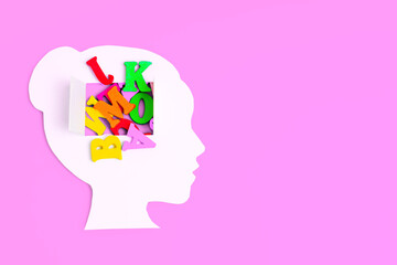 Female Head Paper Cutout with Open Mind and Colorful Letters