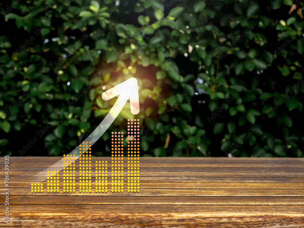 Poster rise up glowing arrow on virtual digital business chart graph steps on table and green leaves backgr