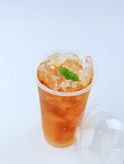 Ice Tea on Plastic Cup with Mint Leaf