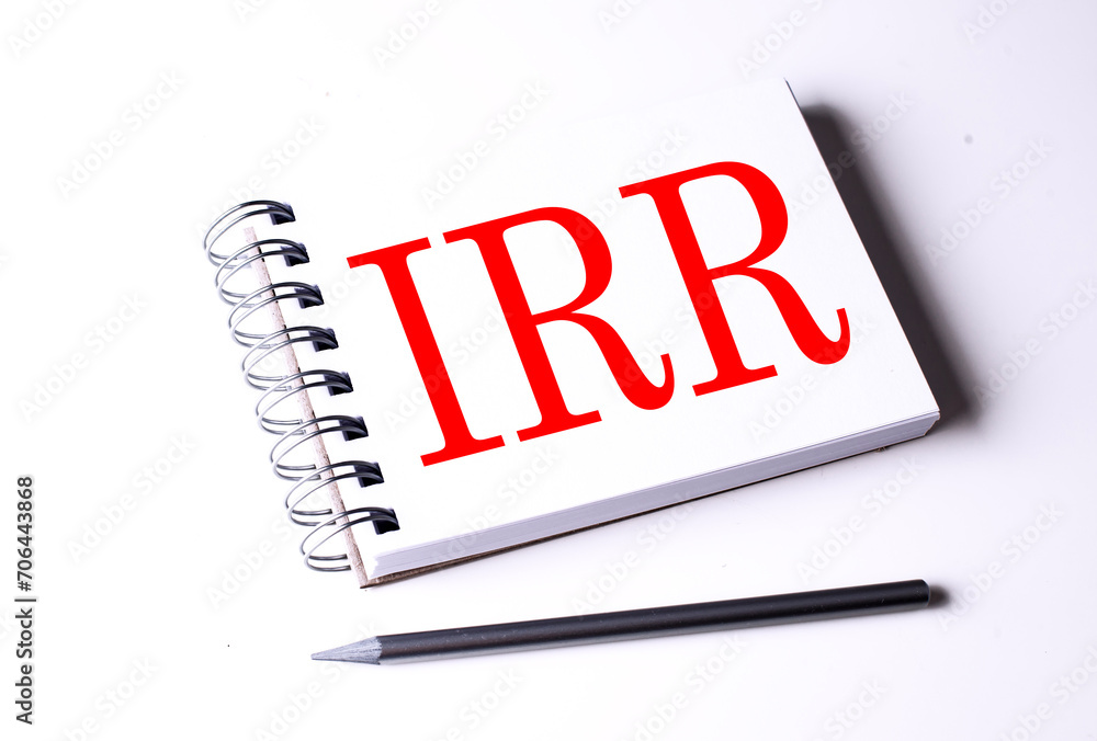 Poster text irr on notebook on the white background, business